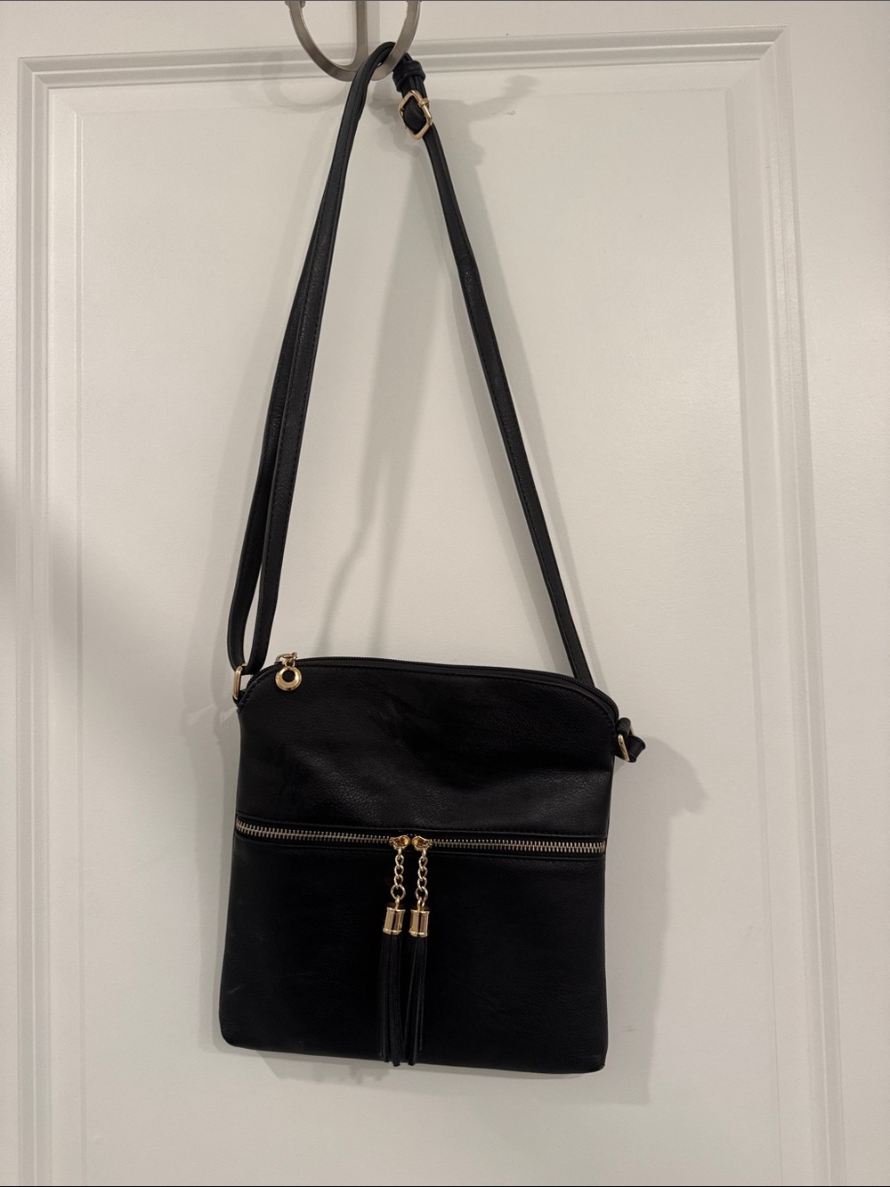 Classic Black Crossbody Bag with Gold Tassel Accents